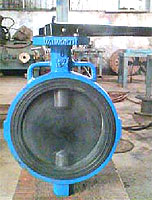 Butterfly valves control flow through a circular disc or vane by turning the valve's pivot axis at right angles to the direction of flow in the pipe. They are normally used as throttling valves to control flow.